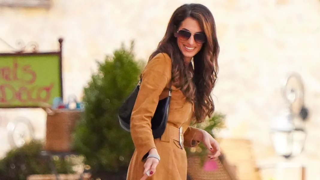Amal Clooney Looks Like a ’70s Bombshell in a Belted Suede Minidress
