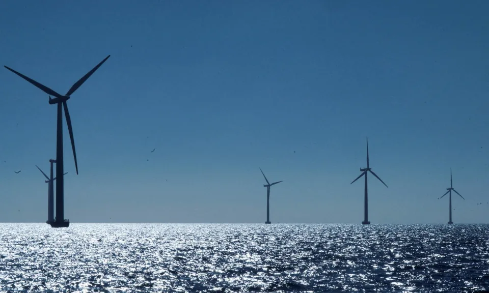 The Danish company developing the world’s largest offshore windfarm in the North Sea is to cut hundreds of jobs and pause its dividend in an attempt to recover from a chaotic 12 months. Ørsted, which is behind the £8bn Hornsea 3 project off the Yorkshire coast, said on Wednesday it planned to axe up to 800 jobs, pull back from markets in Spain, Portugal and Norway, and suspend dividend payments to shareholders covering the 2023-25 financial years. The company said it would cut its target for developing renewable energy capacity by 2030, reducing it from 50 gigawatts to 35-38GW. Its chair, Thomas Thune Andersen, will step down after almost a decade in the role, after the two senior executives who left the business in November. The company, which is majority owned by the Danish government, said the “reset plan” was designed to make it a “leaner and more efficient company”. Ørsted has struggled in the face of high inflation, supply-chain disruption and rising interest rates, which have hit the windfarm industry. The company has also experienced problems in the US in attempting to secure tax credits. Last year, Ørsted cancelled two big offshore windfarm projects in the US, the Ocean Wind I and II schemes, blaming a sharp rise in costs. It took a 28.4bn Danish kroner (£3.3bn) hit as a result of the decision. The company had also raised doubts over the cost of the Hornsea 3 project early last year. However, in December it reaffirmed its commitment to 2.9GW development, which is expected to supply power to 3.3m homes. The RBC analyst Alexander Wheeler said financial markets had been expecting Ørsted to tap investors for funds, “which would have resolved the issues quicker and removed future risk in this regard”. He added: “However, we now have a period where Ørsted needs to execute on various components of its plan to improve its balance sheet metrics over the medium term.” Ørsted has 12 existing windfarms in the UK producing enough energy to power 6m UK homes. It is also working on a floating offshore wind project in Scotland. Separately on Wednesday, the turbine maker Siemens Energy, which was forced to strike a €15bn (£12.8bn) rescue deal with the German government last year, reported a €1.58bn first-quarter profit after selling a stake in its Indian unit. It said orders remained lower than forecast in its turbine division, where newer models have suffered technical faults, but it hoped to break even in that business in 2026. The problems affecting the windfarm industry caused the Swedish energy firm Vattenfall to stop work on the multibillion-pound Norfolk Boreas windfarm last year because it was no longer profitable. The Norwegian oil and gas producer Equinor posted quarterly profits of $8.68bn – down from $17bn a year earlier but ahead of City forecasts – due to lower energy prices. Meanwhile, the British Gas owner Centrica signed an agreement to buy a million metric tonnes of liquified natural gas (LNG) from Spain’s Repsol. The cargoes will be delivered to the Isle of Grain terminal in Kent between 2025 and 2027. Britain has a collection of gas terminals, providing fuel for domestic use and to be re-exported. Germany has raced to bolster its ability to import shipped LNG since piped Russian gas supplies dropped after the invasion of Ukraine, while the US last month moved to curb gas exports by pausing all pending export permits amid climate concerns. The new chief executive of BP said on Tuesday the oil and gas company would take a “more pragmatic” approach to reaching its green targets. Shell faced calls to speed up its investment in renewable energy last week, as it announced bumper profits and shareholder payouts and increased oil and gas production. In January, gas-fired power stations provided the largest share of Great Britain’s electricity supply, at 35.7%, ahead of wind power at 33.5%, National Grid said this week.