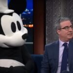 John Oliver Dares Disney to Sue as He Brings Steamboat Willie on Colbert: ‘I’m Legally Indestructible’ | Video
